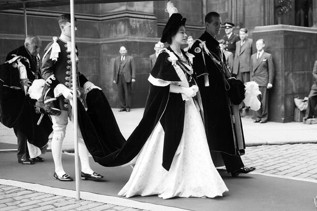 The Queen and the Duke of Edinburgh walk to Signet Library from St Giles' Cathedral after a service.during their Coronation Visit in 1953.
