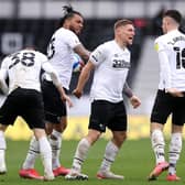 Martyn Waghorn of Derby County celebrates with Colin Kazim-Richards and Tom Lawrence after scoring their side's first goal during the Sky Bet Championship match between Derby County and Sheffield Wednesday at Pride Park Stadium on May 08, 2021 in Derby, England. (Photo by Alex Pantling/Getty Images)