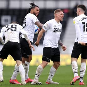 Martyn Waghorn of Derby County celebrates with Colin Kazim-Richards and Tom Lawrence after scoring their side's first goal during the Sky Bet Championship match between Derby County and Sheffield Wednesday at Pride Park Stadium on May 08, 2021 in Derby, England. (Photo by Alex Pantling/Getty Images)