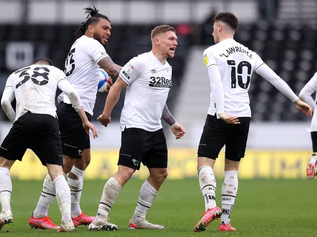 Martyn Waghorn of Derby County celebrates with Colin Kazim-Richards and Tom Lawrence after scoring their side's first goal during the Sky Bet Championship match between Derby County and Sheffield Wednesday at Pride Park Stadium on May 08, 2021 in Derby, England. (Photo by Alex Pantling/Getty Images)