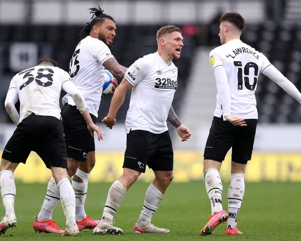 Martyn Waghorn of Derby County celebrates with Colin Kazim-Richards and Tom Lawrence after scoring their side's first goal during the Sky Bet Championship match between Derby County and Sheffield Wednesday at Pride Park Stadium on May 08, 2021 in Derby, England. (Photo by Alex Pantling/Getty Images)