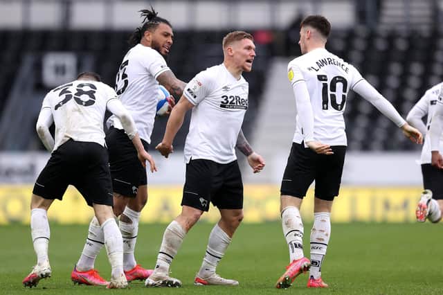 Martyn Waghorn of Derby County celebrates with Colin Kazim-Richards and Tom Lawrence after scoring their side's first goal during the Sky Bet Championship match between Derby County and Sheffield Wednesday at Pride Park Stadium on May 08, 2021 in Derby, England. (Photo by Alex Pantling/Getty Images)