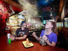 Customers smoke marijuana at the New Amsterdam Cafe in Vancouver, British Columbia, Canada, where Marijuana has been legal since 2018.