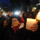 People at a Humanity Not Hatred Vigil, for civilians suffering in Israel and Palestine, in Richmond Terrace, Westminster, central London.