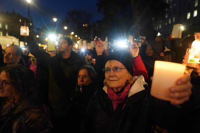 People at a Humanity Not Hatred Vigil, for civilians suffering in Israel and Palestine, in Richmond Terrace, Westminster, central London.