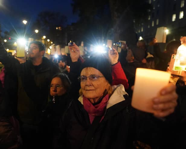 People at a Humanity Not Hatred Vigil, for civilians suffering in Israel and Palestine, in Richmond Terrace, Westminster, central London.
