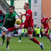 Hibs' Joe Newell is tackled by Aberdeen's David Bates during their Premiership draw at Easter Road. Photo by Ewan Bootman / SNS Group