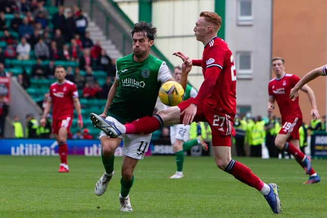 Hibs' Joe Newell is tackled by Aberdeen's David Bates during their Premiership draw at Easter Road. Photo by Ewan Bootman / SNS Group