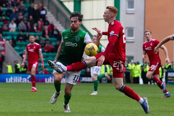 Hibs' Joe Newell is tackled by Aberdeen's David Bates during their Premiership draw at Easter Road. Photo by Ewan Bootman / SNS Group