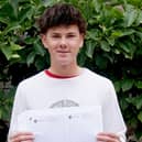 St Leonards pupil with his GCSE results envelope. Photo: St Leonards School