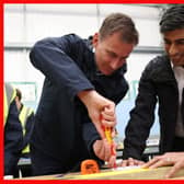 Prime Minister Rishi Sunak (right) and Chancellor of the Exchequer Jeremy Hunt doing electrical work during a visit to the Enfield Centre, part of the Capital City College Group,  in north London. Picture: Daniel Leal/PA Wire