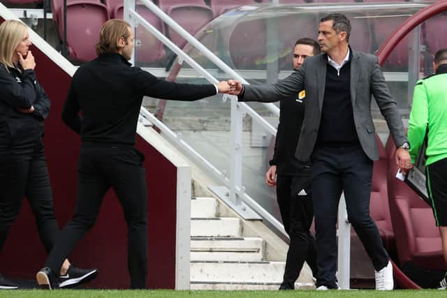 Hearts manager Robbie Neilson (L) and Hibs manager Jack Ross at full time in the Edinburgh derby.