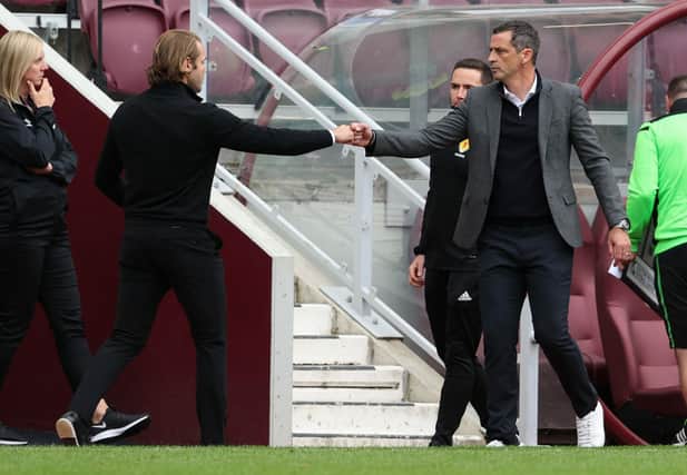 Hearts manager Robbie Neilson (L) and Hibs manager Jack Ross at full time in the Edinburgh derby.