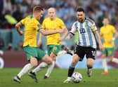 Lionel Messi of Argentina battles for possession with Kye Rowles of Australia during their FIFA World Cup Qatar 2022 round of 16 match. Photo by Michael Steele/Getty Images
