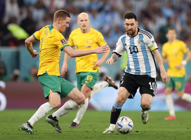 Lionel Messi of Argentina battles for possession with Kye Rowles of Australia during their FIFA World Cup Qatar 2022 round of 16 match. Photo by Michael Steele/Getty Images