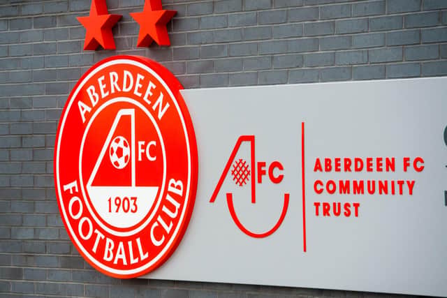 An Aberdeen player has tested positive for Covid-19.