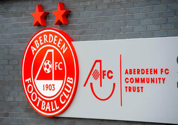 An Aberdeen player has tested positive for Covid-19.