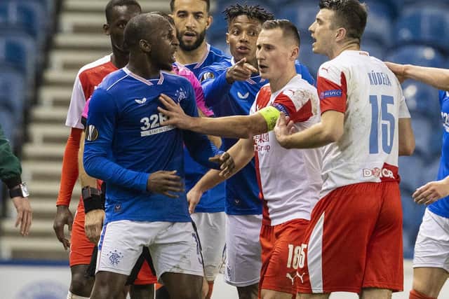 Rangers' Glen Kamara takes exception to something said by Slavia's Ondrej Kudela during the UEFA Europa League Round of 16 2nd Leg match between Rangers FC and Slavia Prague at Ibrox Stadium on March 18, 2021, in Glasgow, Scotland.  (Photo by Alan Harvey / SNS Group)