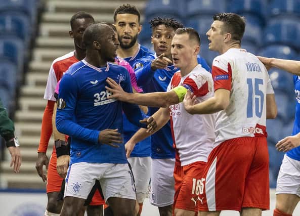 Rangers' Glen Kamara takes exception to something said by Slavia's Ondrej Kudela during the UEFA Europa League Round of 16 2nd Leg match between Rangers FC and Slavia Prague at Ibrox Stadium on March 18, 2021, in Glasgow, Scotland.  (Photo by Alan Harvey / SNS Group)