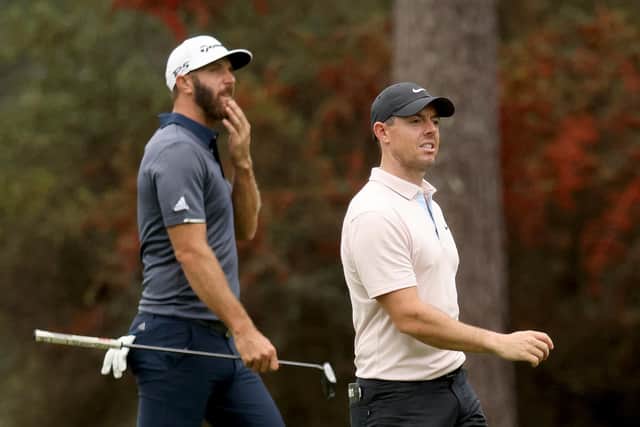 World No 1 Dustin Johnson and fifth-ranked Rory McIlroy walk together during a practice round prior to the Masters at Augusta National. Picture: Rob Carr/Getty Images