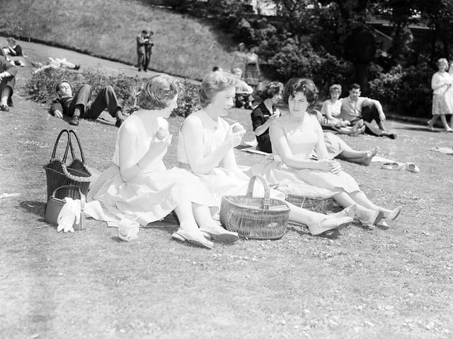 Three girls lunching in Princes Street Gardens during a heatwave in Edinburgh in June 1960.