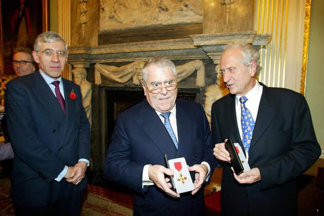 Foreign Secretary Jack Straw (L) after presenting Albert and Michel Roux with their honorary OBE medals at the Foreign Office in London 31 October 2002. The brothers received the honor for their services to cooking. Pic: ADRIAN DENNIS/AFP via Getty Images