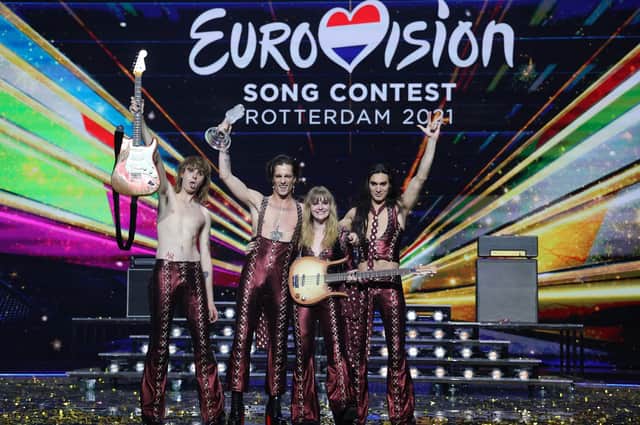 Italy's Maneskin pose for pictures on stage with the trophy after winning the final of the 65th edition of the Eurovision Song Contest 2021, at the Ahoy convention centre in Rotterdam