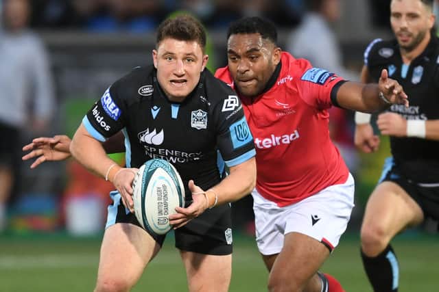 Duncan Weir is tackled by George Wacokecoke during Glasgow Warriors pre-season match against Newcastle Falcons at Scotstoun. Picture: Ross MacDonald/SNS