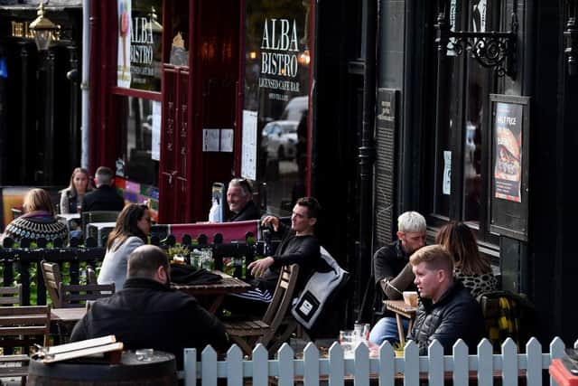 will also see cafés, restaurants and bars begin serving customers outdoors, in groups of up to six people from three households until 10pm. (Photo by Jeff J Mitchell/Getty Images)