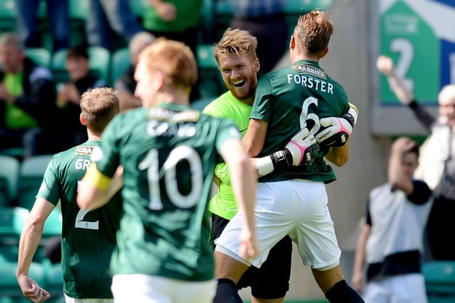 Hibernian goalkeeper Mark Oxley (left) celebrates his goal with team-mate Jordan Forster.