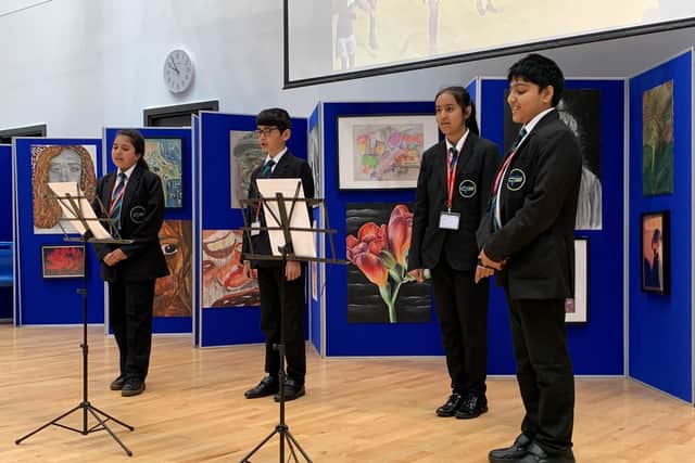 A group of Year 7 students, singing the One Britain One Nation Day song in the school hall at Carlton Bolling College in West Yorkshire