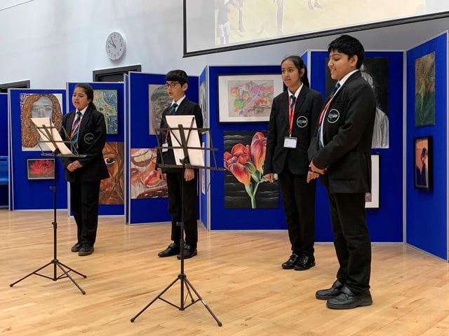 A group of Year 7 students, singing the One Britain One Nation Day song in the school hall at Carlton Bolling College in West Yorkshire