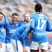 James Tavernier (L) of Rangers celebrates their team's first goal with teammates, an own goal scored by Joe Lewis of Aberdeen.  (Photo by Ian MacNicol/Getty Images)