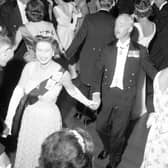 Queen Elizabeth II dances an eightsome reel at the Royal Company of Archers' Ball in the Assembly Rooms, Edinburgh, in 1966.