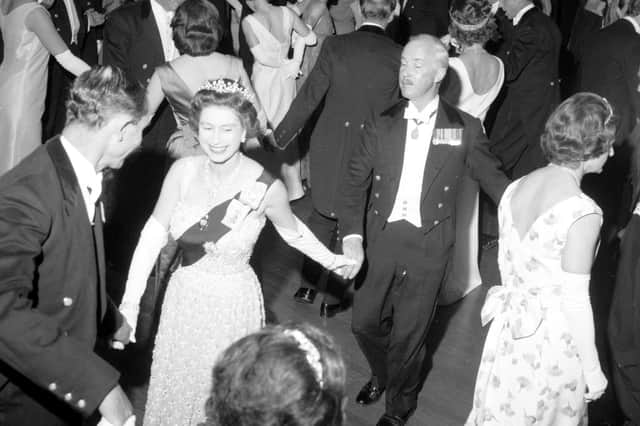 Queen Elizabeth II dances an eightsome reel at the Royal Company of Archers' Ball in the Assembly Rooms, Edinburgh, in 1966.