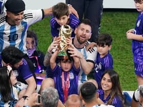 Argentina's Lionel Messi sits with family members after the FIFA World Cup final at Lusail Stadium, Qatar.