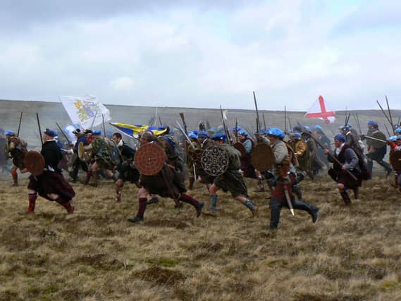 A reconstruction of the battle charge at Culloden in 1746. Development on the battlefield, of which two thirds is owned privately, has helped focus attempts for better protection of such historic sites . PIC: NTS.