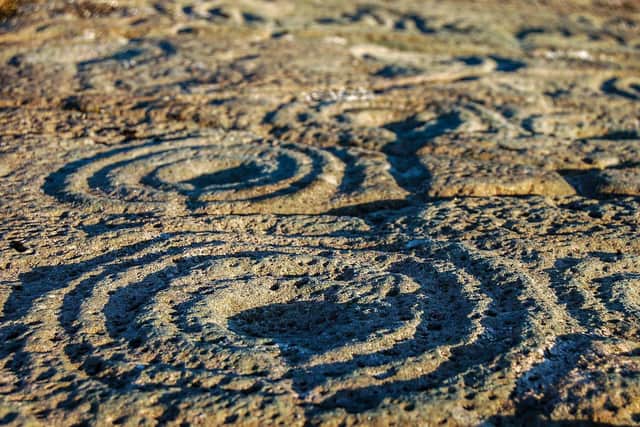 Rock art at Cairnbaan. More than 300 examples of rock art, dating from the Neolithic and Bronze Age, are found through the glen as residents made their mark on their landscape. PIC: Contributed.
