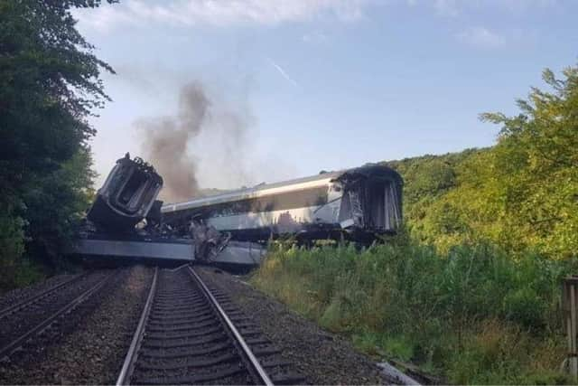 The wrecked carriages have yet to be moved.