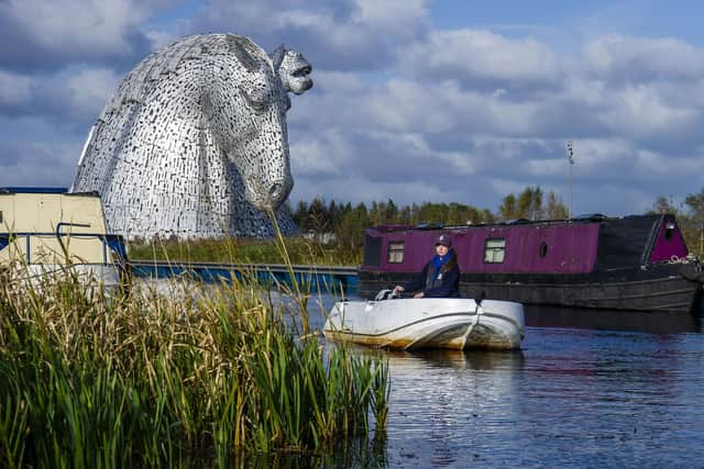 Scottish Canals activities assistant Rebecca Brown provides instruction to people hiring the electric boats. (Photo by Lisa Ferguson/The Scotsman)