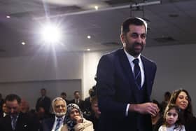 Humza Yousaf walks to the stage to speak after being elected as new SNP party leader