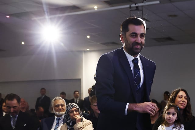 Humza Yousaf walks to the stage to speak after being elected as new SNP party leader