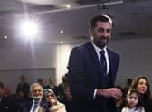 Humza Yousaf walks to the stage to speak after being elected as new SNP party leader