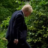 Prime Minister Boris Johnson heads to a press conference in Downing Street, London, following the publication of Sue Gray's report into Downing Street parties in Whitehall during the coronavirus lockdown. Picture date: Wednesday May 25, 2022.