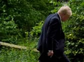 Prime Minister Boris Johnson heads to a press conference in Downing Street, London, following the publication of Sue Gray's report into Downing Street parties in Whitehall during the coronavirus lockdown. Picture date: Wednesday May 25, 2022.