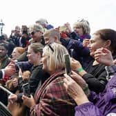 King Charles III meets members of the public in the queue along the South Bank, near to Lambeth Bridge, London, as they wait to view Queen Elizabeth II lying in state ahead of her funeral on Monday. Picture: PA