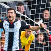 St Mirren's Mihai Popescu celebrates scoring for St Mirren during the play-off penalty shootout win over Robbie Neilson's Dundee United. Photo: Rob Casey/SNS Group