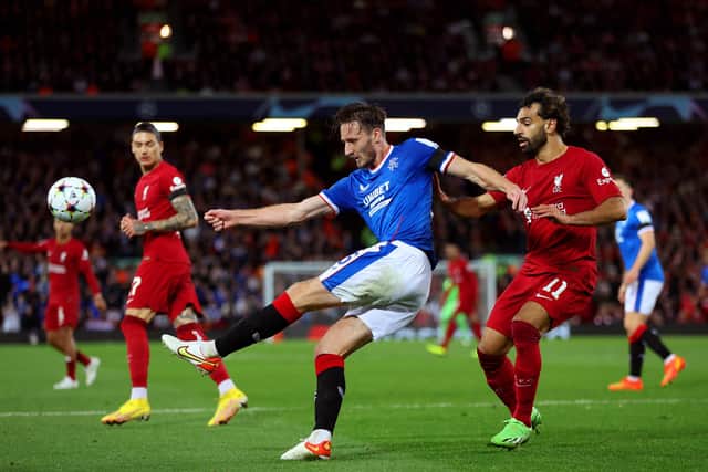 Ben Davies of Rangers is challenged by Mohamed Salah of Liverpool during the UEFA Champions League group A match between Liverpool FC and Rangers FC at Anfield on October 04, 2022 in Liverpool, England. (Photo by Clive Brunskill/Getty Images)
