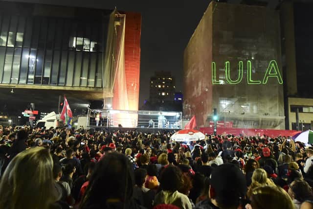 Supporters of former President of Brazil and Candidate for the Worker's Party (PT) Luiz Inacio Lula da Silva wait for him at the end of the general election day at Paulista avenue on October 2, 2022 in Sao Paulo, Brazil. (Photo by Mauro Horita/Getty Images)