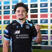 Sione Tuipulotu with his player of the match award after the win over Ospreys. (Photo by Craig Williamson / SNS Group)